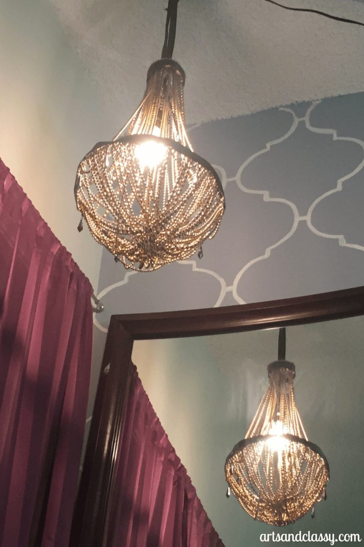 DIY vintage glam waterfall chandelier is apart of my bedroom makeover design on a dime via www.artsandclassy.com