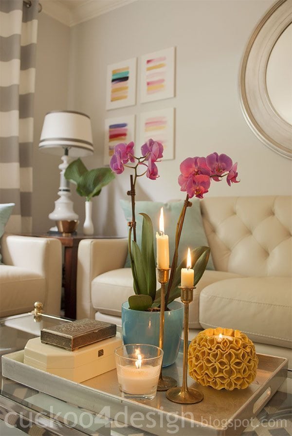 6 Important Small Apartment Decorating Tips - Staged vignettes in a home will look much cleaner and clutter free giving the space a much larger look.