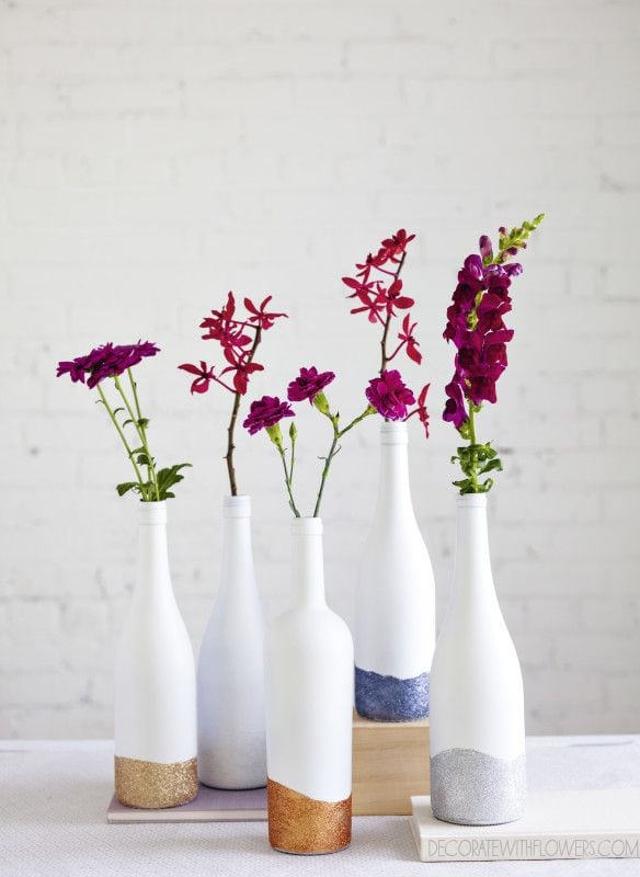 Decorate your room with flowers and this wine bottle craft.