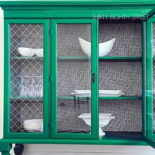 Painted hutch furniture flip with emerald green paint - Green is a hot home decor trend right now, so check out these gorgeous furniture flips. Furniture makeovers with all shades of green paint | Green painted furniture. 