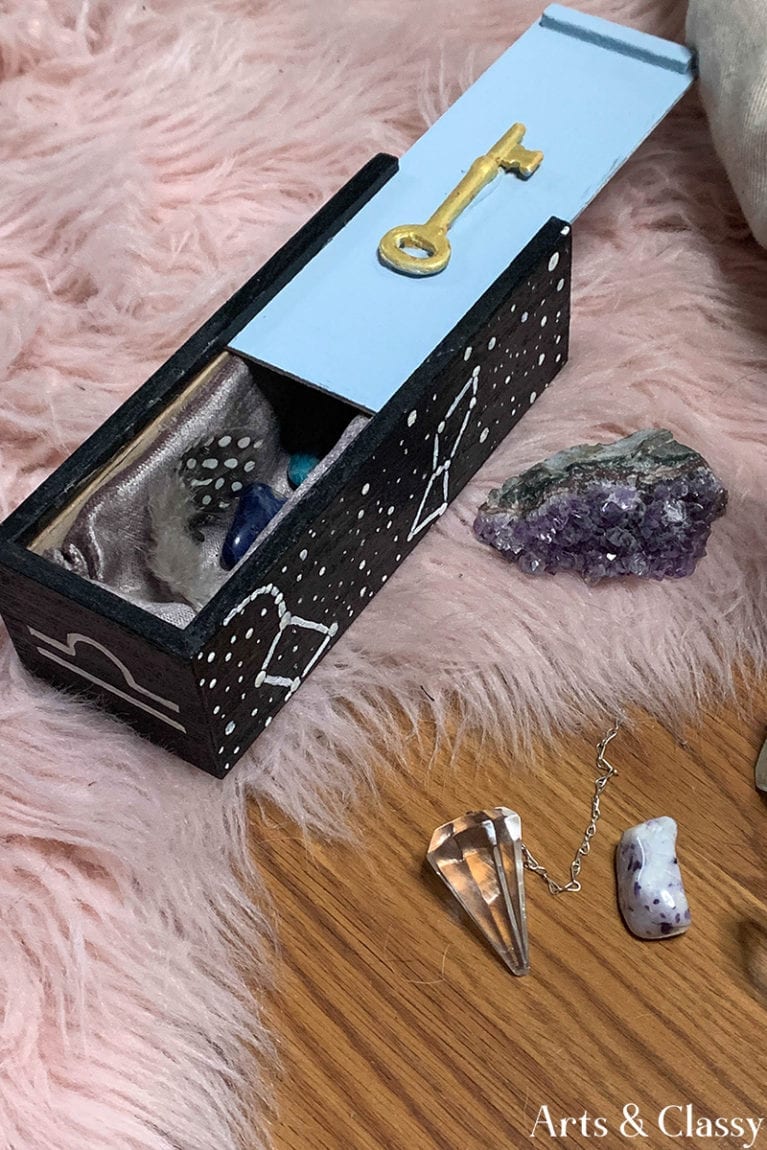 How do you organize your crystal collection? Learn tips and storage ideas for using a wooden tea box for organizing and traveling with your rocks in a beautiful and safe manner. #FindingMagick #crystals #crystalhealing #organizing #crystalcollection #organizingcrystals #homedecor #magick#decor #storage #gemstones #stones #rocks #woodbox #upcycle