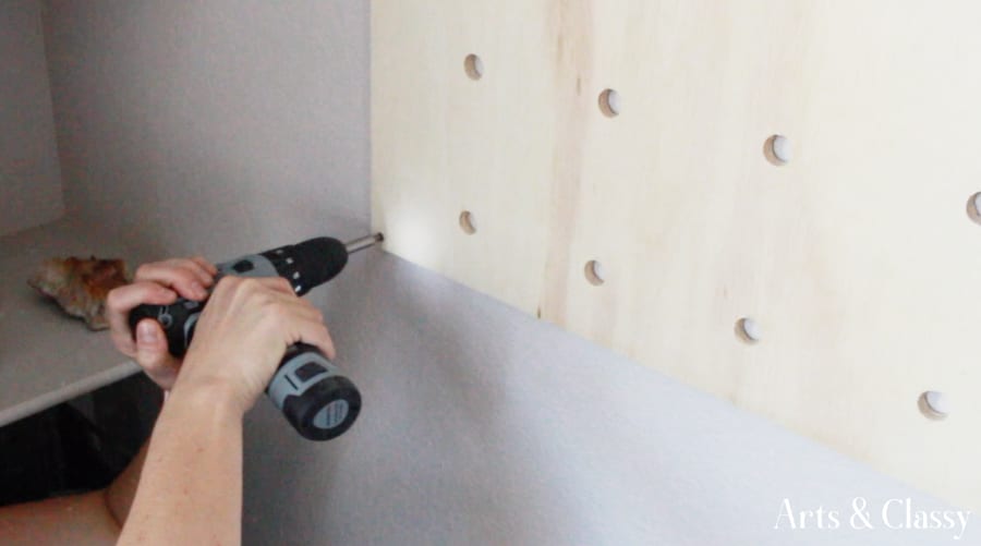 DIY Pegboard Entryway Project - mounting pegboard to the wall