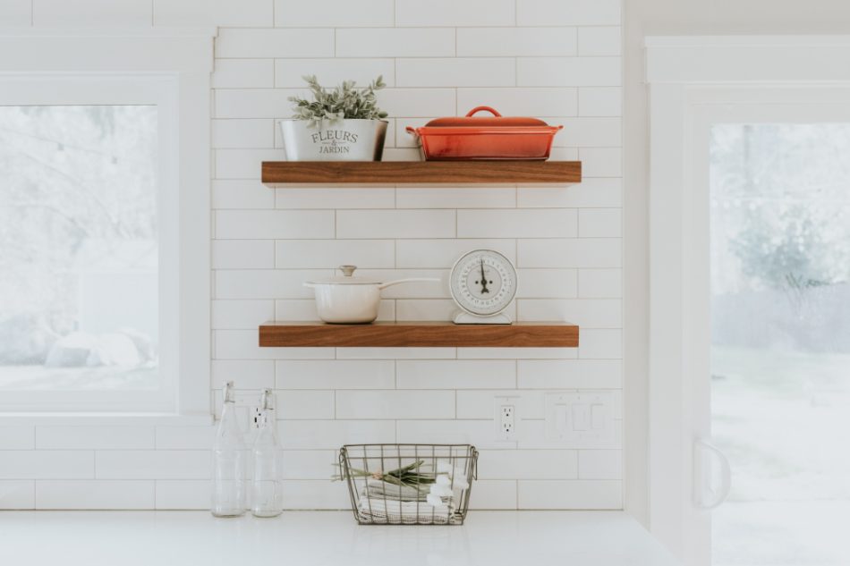 Using things like open shelving helps to simplify your life and be a great way to rearrange often. It prevents clutter from building because you can see everything. Not only is this a smart organizing tactic, it allows you to add and change out decor as you see fit. 