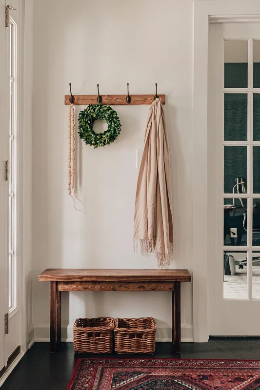 An entryway bench or shelf can add both storage and style to your home.