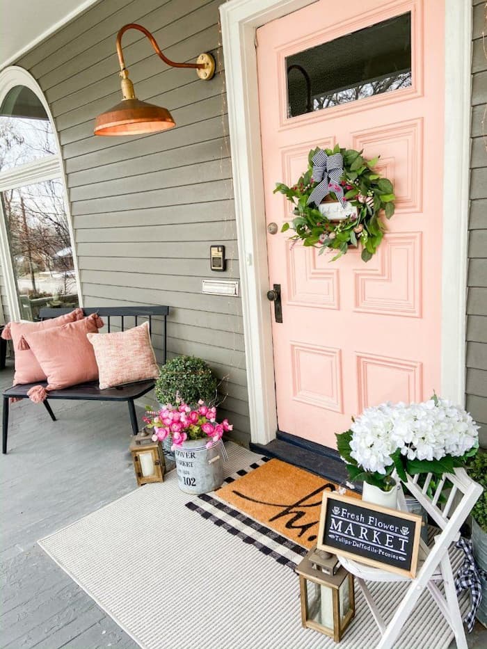 This spring, try incorporating flower pots and pot decor into your DIY front door decorations. Utilize a wreath hanger to hang two or three matching potted plants. Stand out from the crowd with some DIY wreath hanger door decorations. Challenge the traditional norms by changing out wreaths and add flower pots for a pop of color. 
