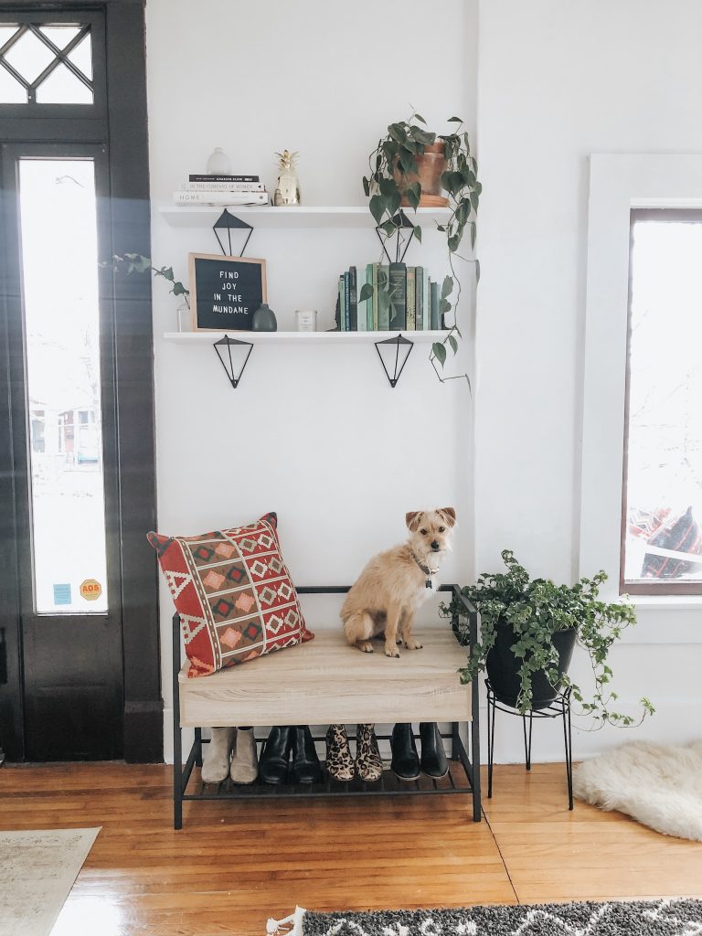 An entryway bench or shelf can add both storage and style to your home.