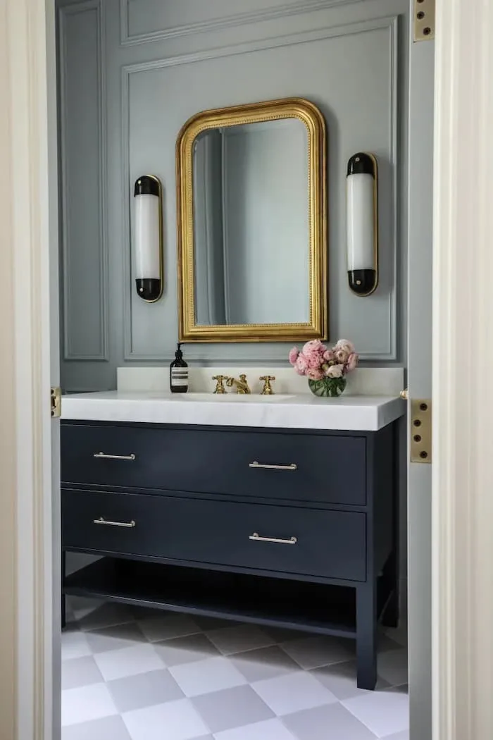 8 Essential Tips for Decorating a Navy Blue Bathroom on a Tight Budget - Upgrade Your Lighting Fixtures