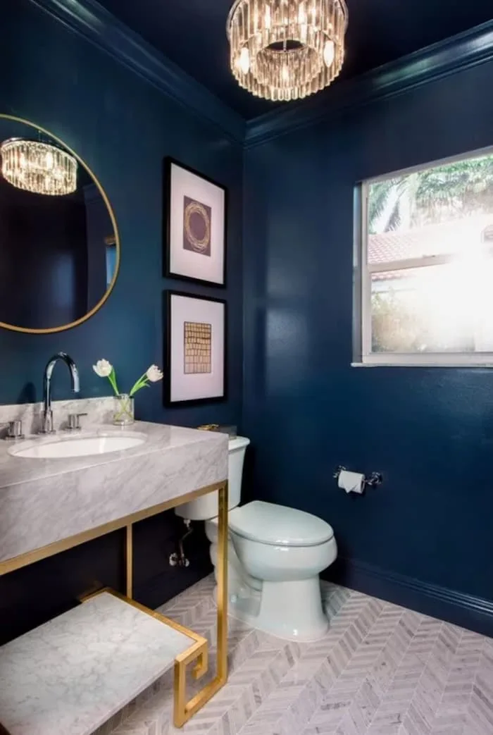 8 Essential Tips for Decorating a Navy Blue Bathroom on a Tight Budget - Upgrade Your Lighting Fixtures
