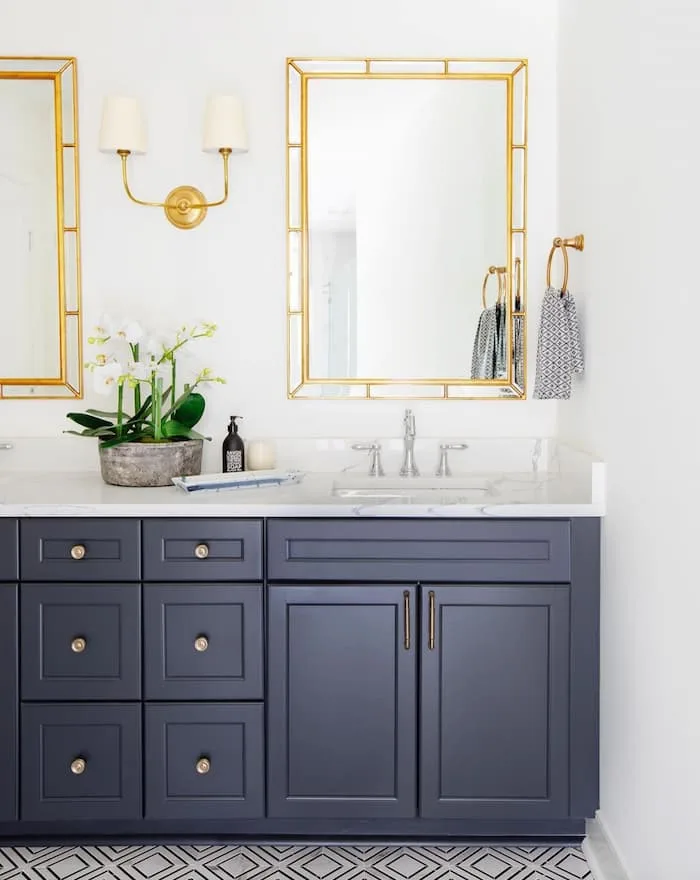 Navy bathroom and marble countertops