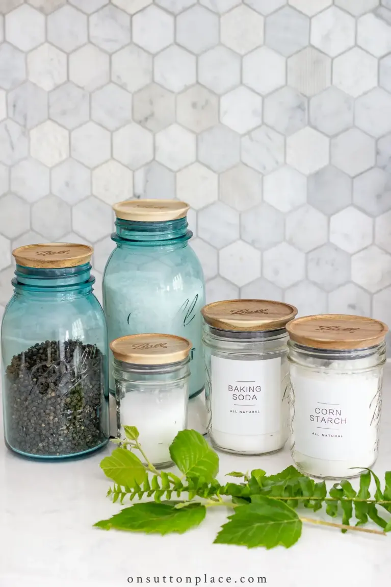 Uncover the essential elements that make farmhouse kitchens a delightful blend of rustic aesthetics and modern functionality. Mason jars are great addition for extra storage.