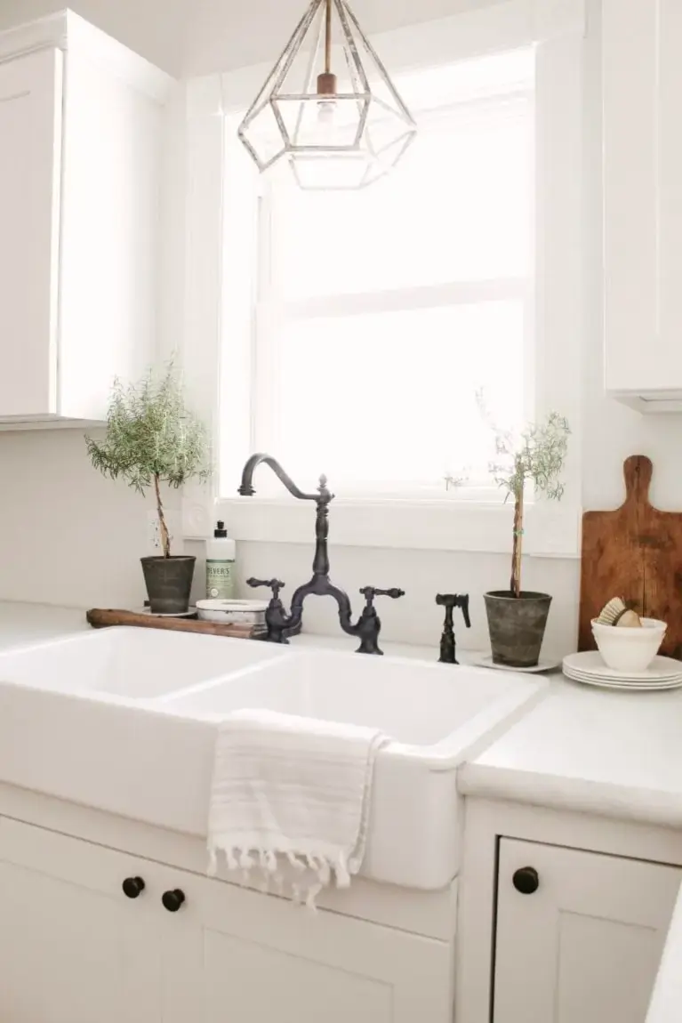 Elevate your kitchen decor with these essential elements of farmhouse style, creating a cozy and timeless ambiance. A farmhouse apron sink is a must.
