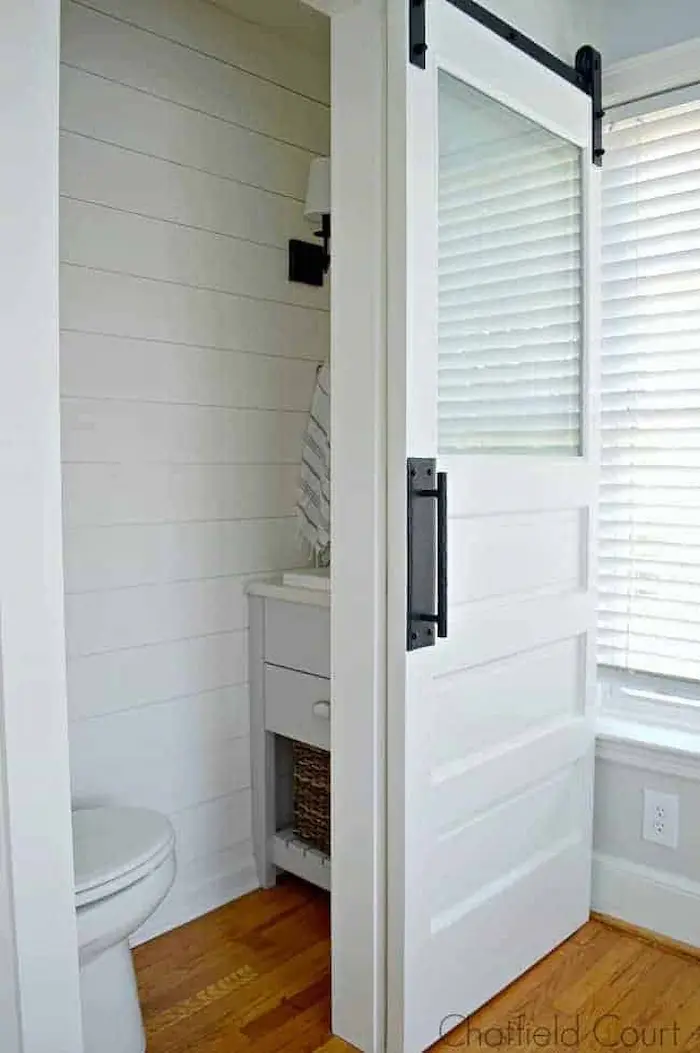 Small but Mighty - 19 Clever Powder Room Ideas for Limited Spaces - Opt For a Sliding Barn Door