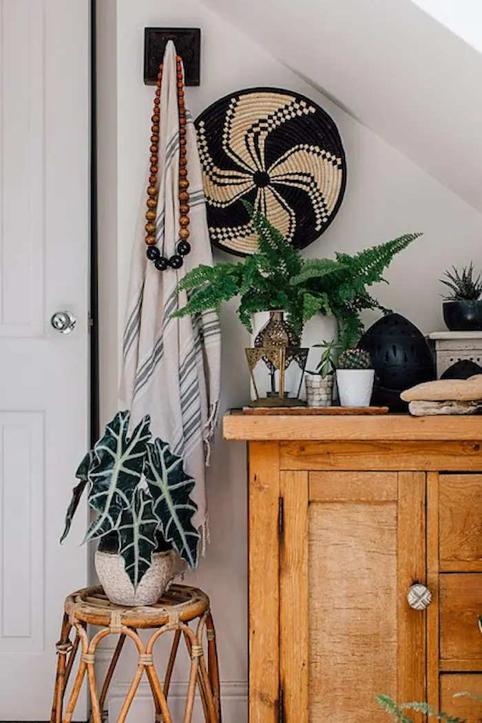 Serene bedroom adorned with cozy thrifted bedding and natural elements