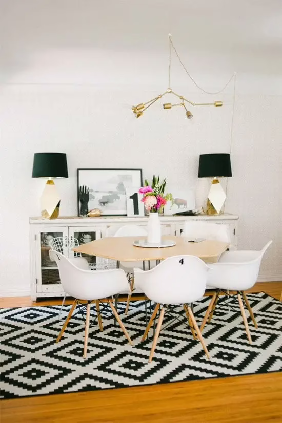 Oversized area rug grounding a modern living space to create a high-end designer look